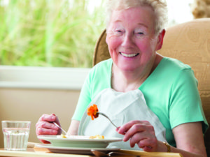 Senior woman eating - Measuring Activities of Daily Living (ADLs)
